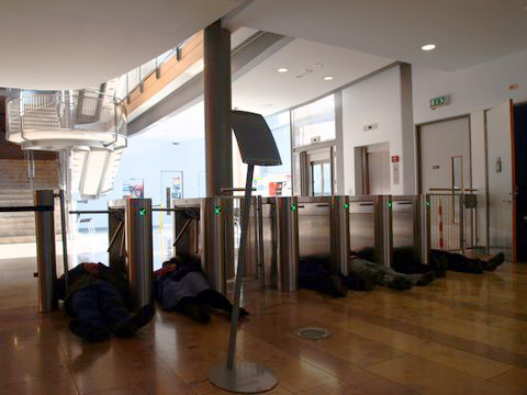Paul Couillard: <em>Subject/ object</em>, volunteers on the floor of the foyer of the University of Ulster, 2010, performance shot, <em>CHAOS</em>; photo Jordan Hutchings; courtesy CHAOS” width=”400″><br /><br>
<div class=